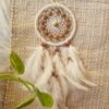 small car hanging white dreamcatcher