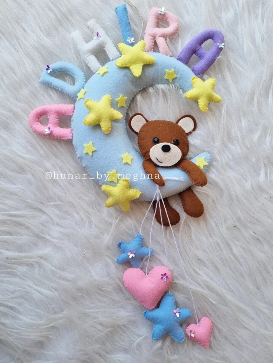 teddy moon name hanging in pastel shades