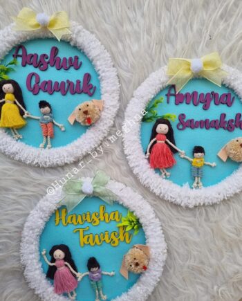siblings doll name hanging in a furry ring