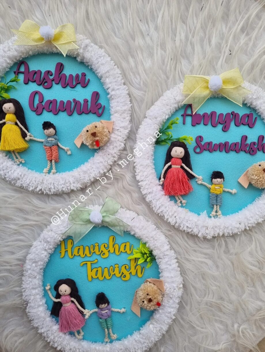 siblings doll name hanging in a furry ring