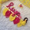 macrame handmade doll and leaves hanging