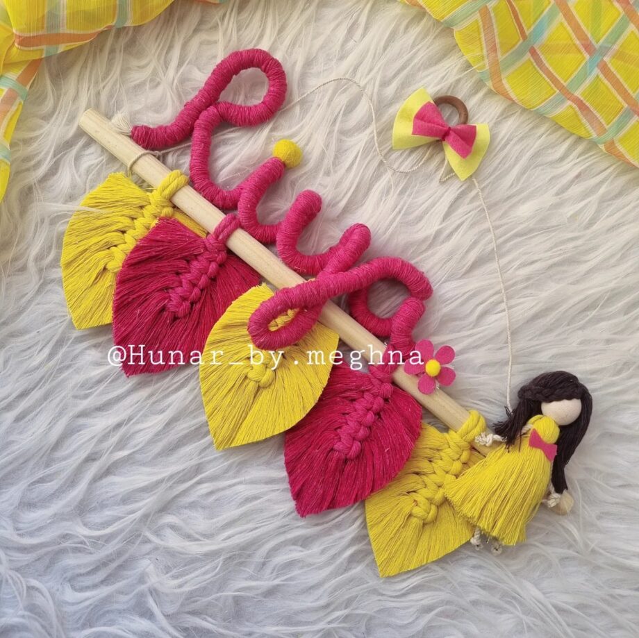 macrame handmade doll and leaves hanging