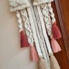 pretty macrame name hanging with rustic color pallet