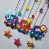 cute animals in cool cars made with hand stitching felt in bright colors
