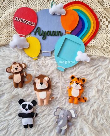 colorful balloons with cute animals name hanging and birth stats decor