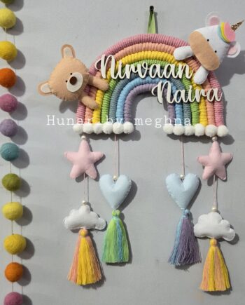 handcrafted macrame rainbow in pastel colors with kids name and cute felt unicorn and felt teddy cotton thread tassles with cute hearts, stars and clouds