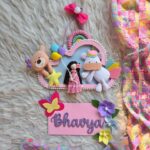 macrame doll and felt unicorn teddy name plate with wooden cloud and name plank in pretty pink color for nursery decor and kids room decor